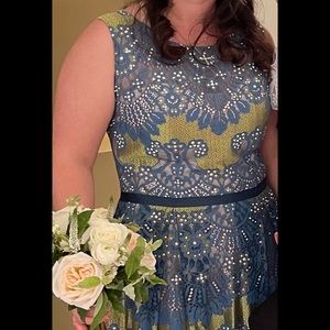 Beautiful Jovani peacock colored dress with embellishments. Worn once.